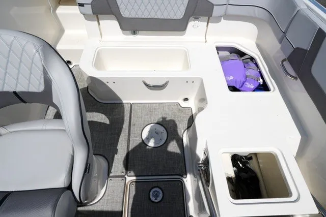 Slide: The Image of 2024 Bayliner VR5 Bowrider I/O interior with storage compartments and seating. - 16