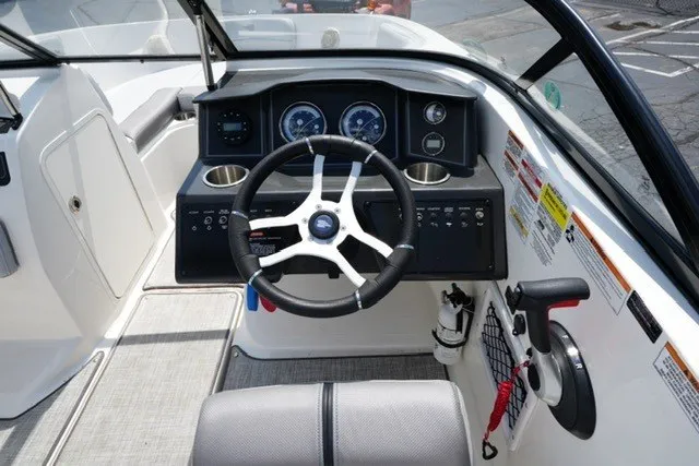 Slide: The Image of 2024 Bayliner VR5 Bowrider I/O dashboard with steering wheel and instrument panel. - 14