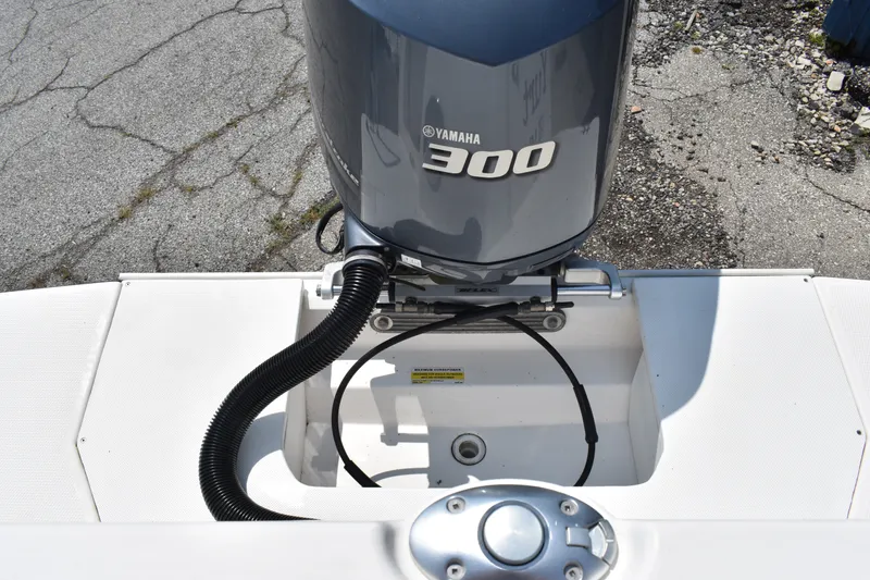 Slide: The Image of Yamaha 300 outboard motor on 2019 Ranger Tugs R-27 boat, docked on concrete surface. - 14