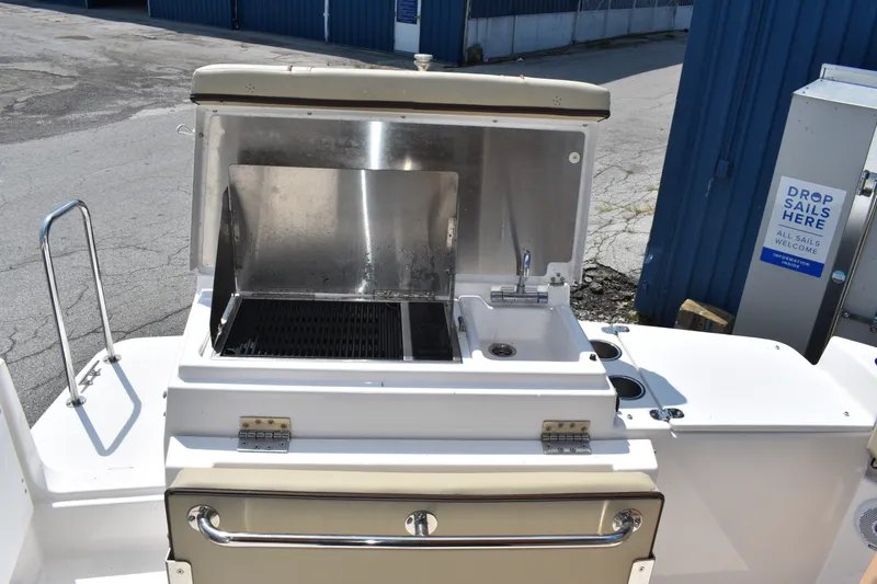 Slide: The Image of Outdoor kitchen on 2019 Ranger Tugs R-27 boat with grill and sink. - 21