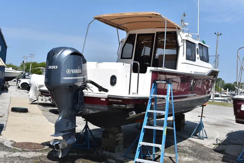 Slide: The Image of 2019 Ranger Tugs R-27 boat with Yamaha 300 outboard motor on dry dock. - 7