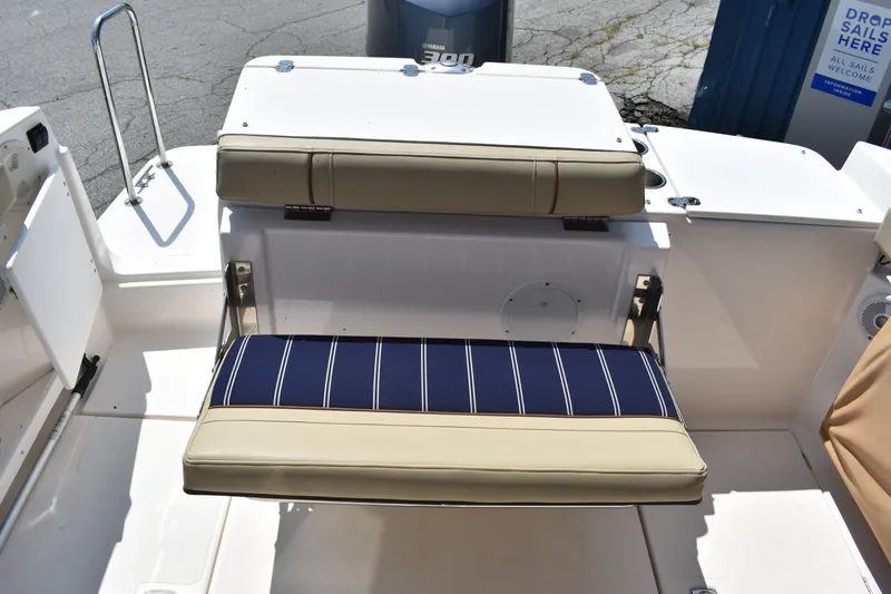 Slide: The Image of 2019 Ranger Tugs R-27 boat seat with striped cushion and beige backrest. - 20