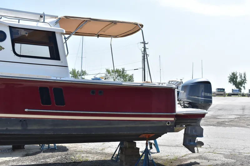Slide: The Image of 2019 Ranger Tugs R-27 boat with Yamaha outboard motor on dry dock. - 4