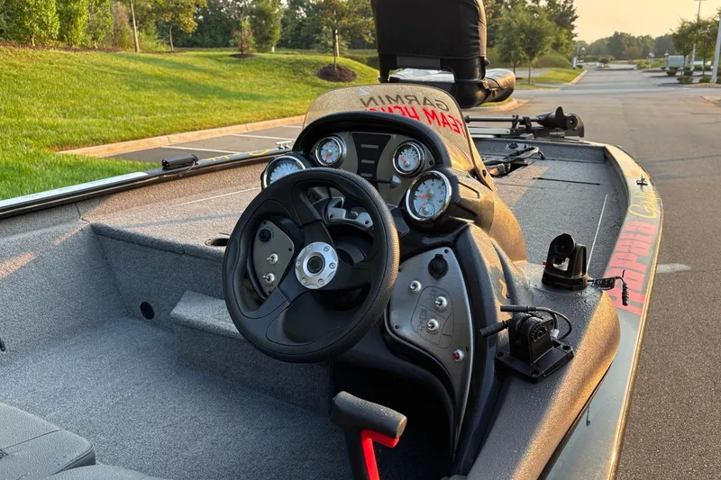 Slide: The Image of 2020 Tracker Pro Team 190 TX boat interior with steering wheel and gauges. - 13