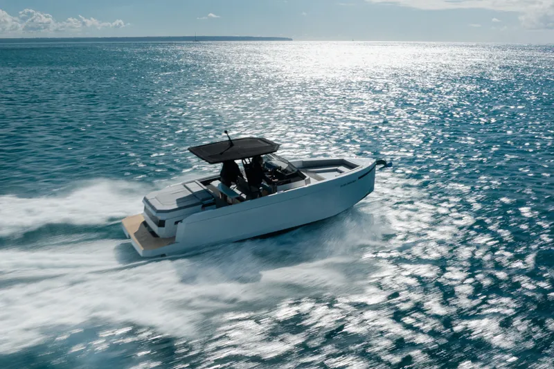 The Image of 2027 De Antonio Yachts D29 cruising on open water under a clear sky. - 1
