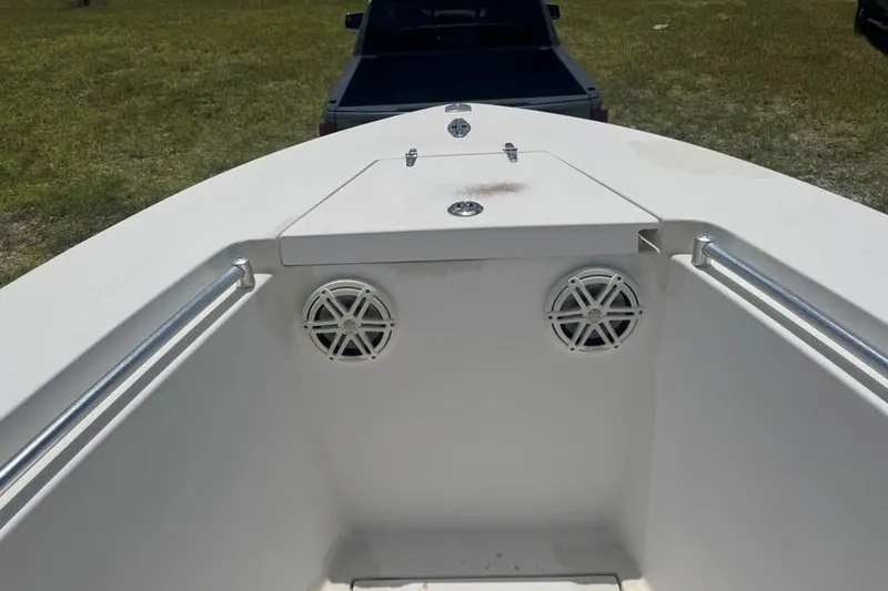 Slide: The Image of 2007 Contender 23 Open boat bow with speakers and storage compartment. - 8