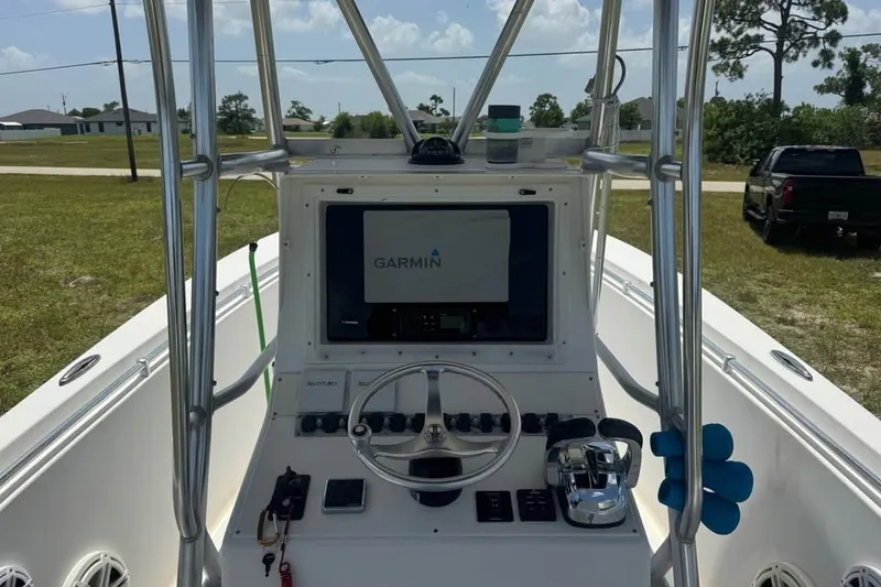 Slide: The Image of 2007 Contender 23 Open boat dashboard with Garmin navigation system. - 4