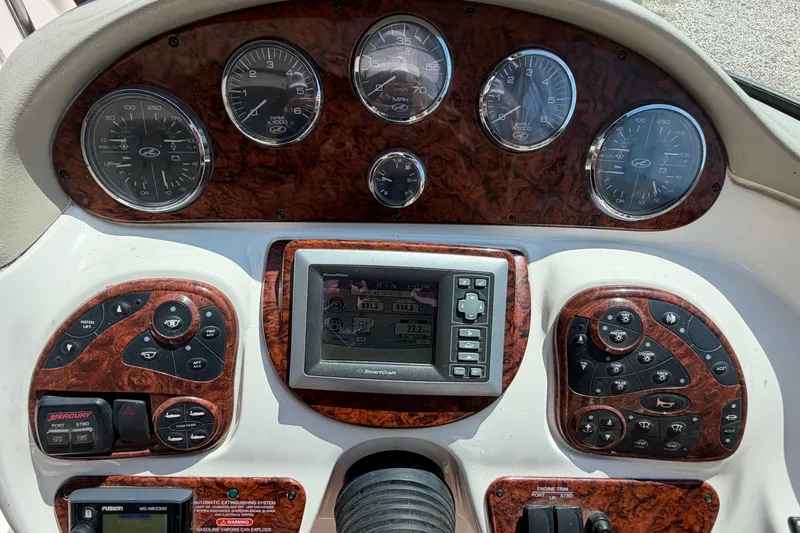 Slide: The Image of Dashboard of a 2008 Sea Ray 290 SLX boat with gauges and controls. - 22