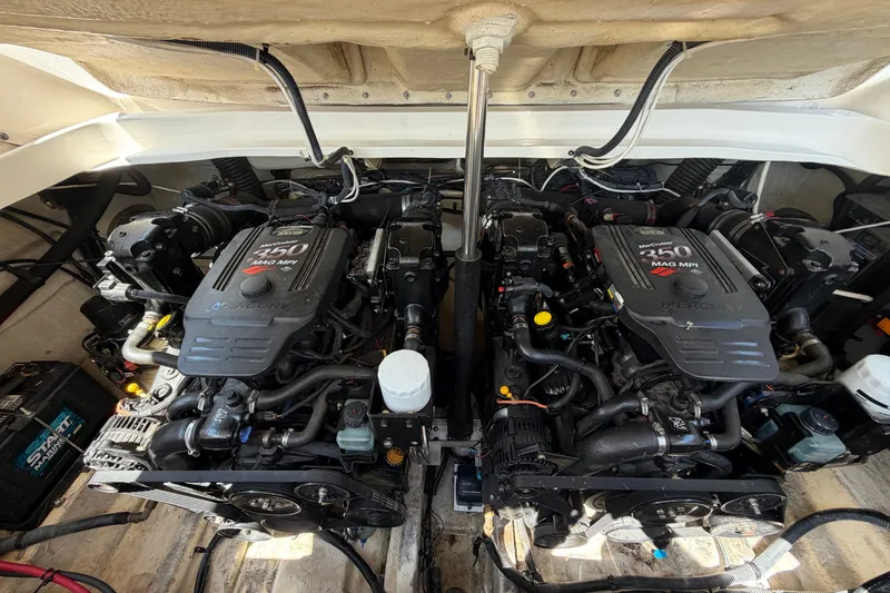 Slide: The Image of Twin Mercury engines in a 2008 Sea Ray 290 SLX boat engine compartment. - 36