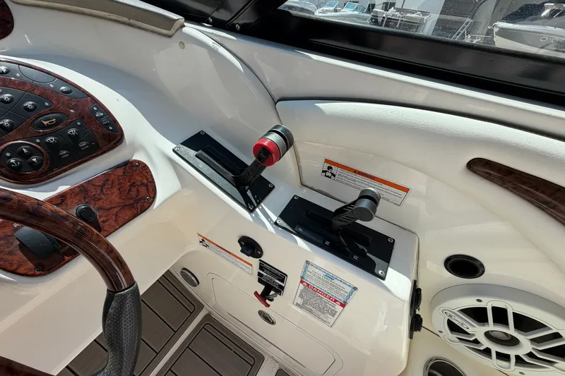 Slide: The Image of 2008 Sea Ray 290 SLX boat dashboard with controls and speaker. - 19