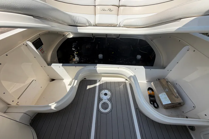 Slide: The Image of 2008 Sea Ray 290 SLX boat engine compartment with open hatch and visible components. - 32