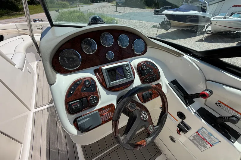 Slide: The Image of 2008 Sea Ray 290 SLX boat dashboard with gauges and controls. - 18