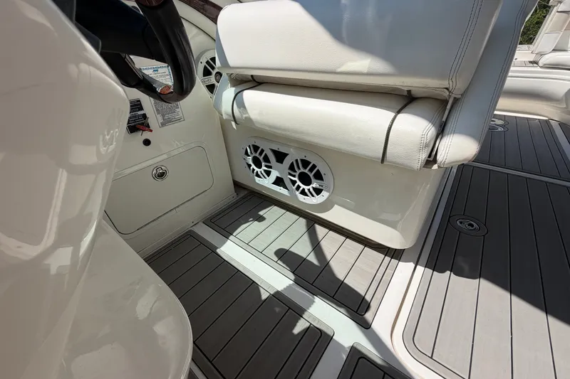 Slide: The Image of Interior of 2008 Sea Ray 290 SLX boat with seating and speaker system. - 29