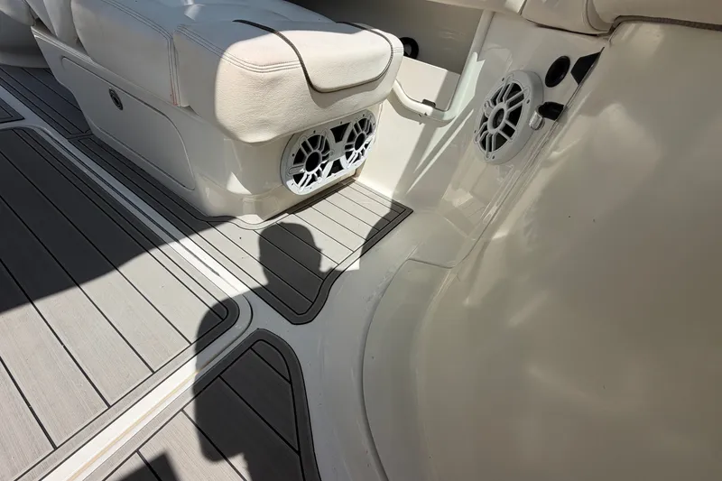 Slide: The Image of Interior of a 2008 Sea Ray 290 SLX boat with seating and speakers. - 28