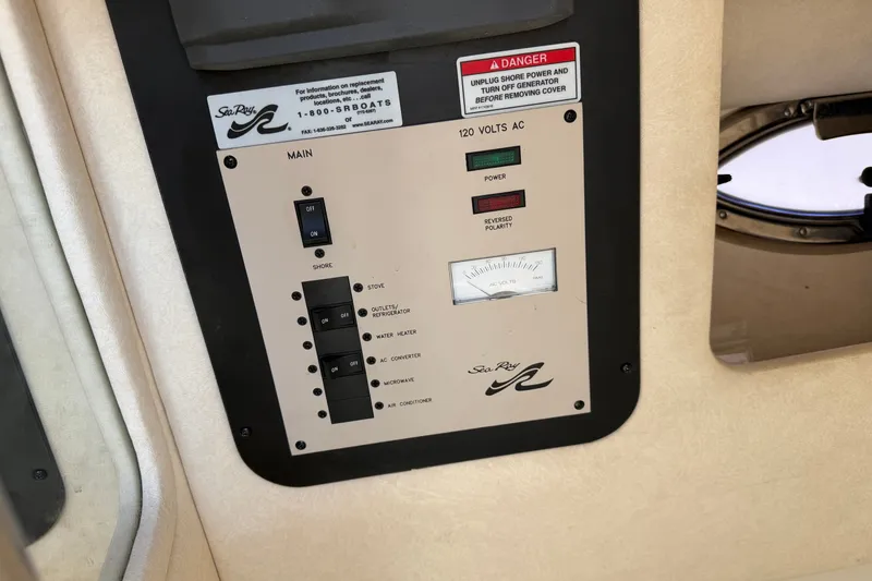 Slide: The Image of Control panel of a 2008 Sea Ray 290 SLX boat, showing power switches and indicators. - 31