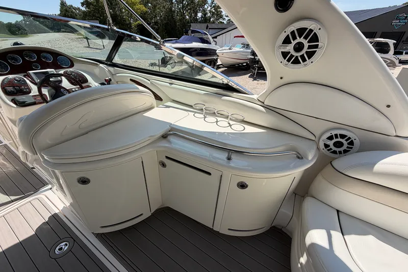 Slide: The Image of 2008 Sea Ray 290 SLX boat interior with helm, seating, and speakers. - 13