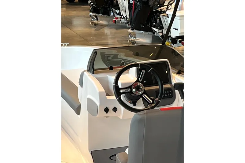Slide: The Image of Steering console of 2027 Tahoe T21 boat with modern controls and sleek design. - 4