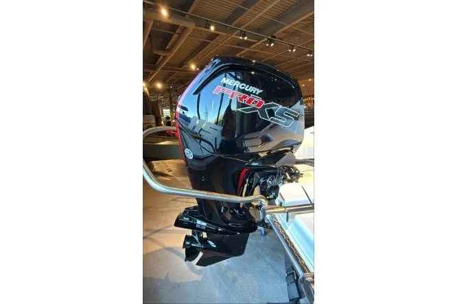 Slide: The Image of Mercury Pro XS outboard motor on 2027 Tahoe T18 boat in showroom. - 3