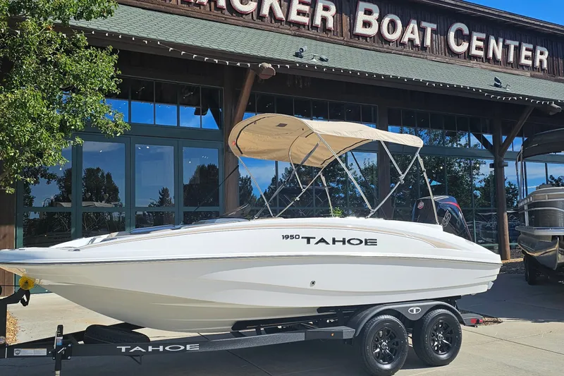 The Image of 2027 Tahoe 1950 boat displayed at Tracker Boat Center, featuring sleek design and canopy. - 0