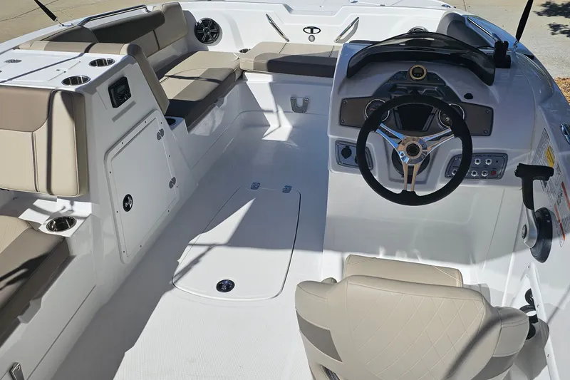 Slide: The Image of 2027 Tahoe 1950 boat interior with steering wheel, seating, and control panel. - 9
