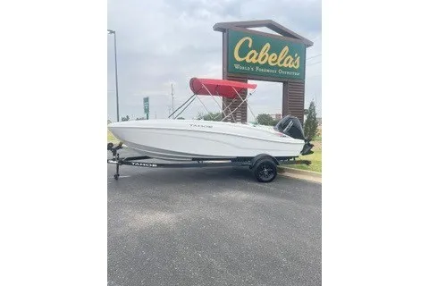 The Image of 2027 Tahoe T18 boat with red canopy on trailer at Cabela's parking lot. - 0