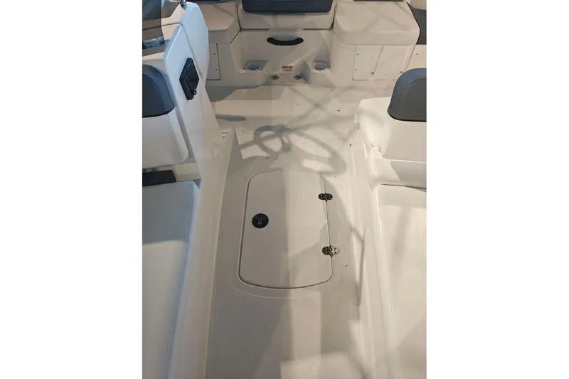 Slide: The Image of 2027 Tahoe T18 boat interior with white seating and storage compartment. - 13