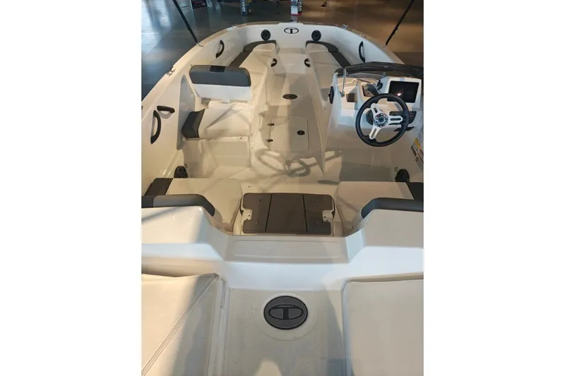 Slide: The Image of 2027 Tahoe T18 boat interior with seating and steering wheel, showcasing modern design. - 9
