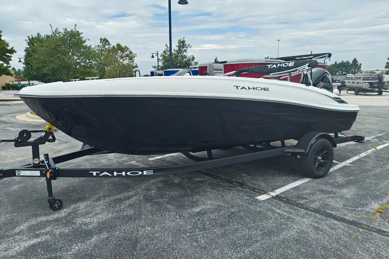 Slide: The Image of 2027 Tahoe T18 boat on trailer in parking lot, showcasing sleek design. - 1