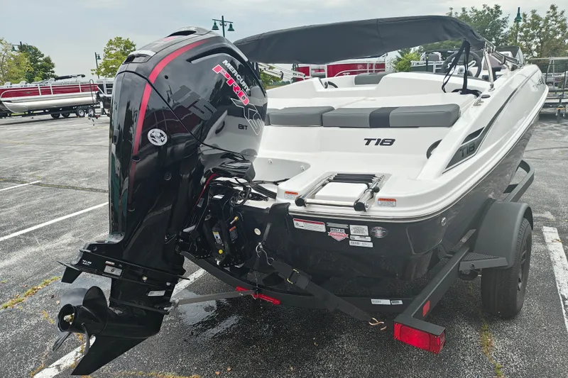 Slide: The Image of 2027 Tahoe T18 boat with Mercury Pro XS outboard motor in a parking lot. - 5