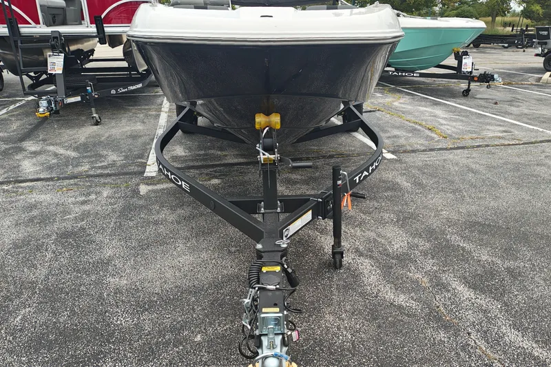 Slide: The Image of 2027 Tahoe T18 boat on trailer in parking lot. - 4