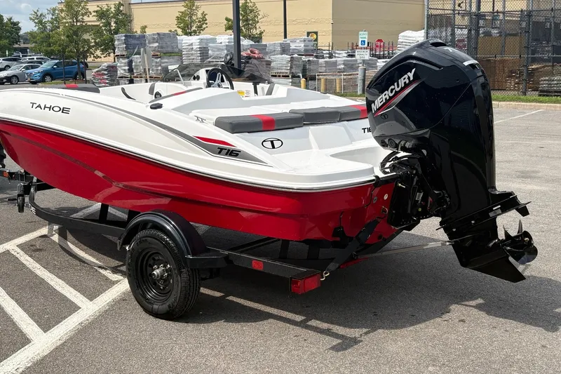 Slide: The Image of 2027 Tahoe T16 boat with Mercury engine on trailer in parking lot. - 3