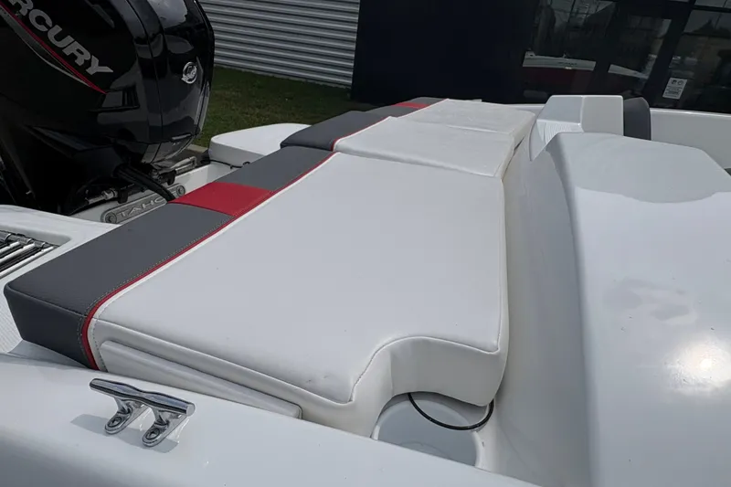 Slide: The Image of 2027 Tahoe T16 boat with Mercury engine, featuring sleek white and gray seating. - 4