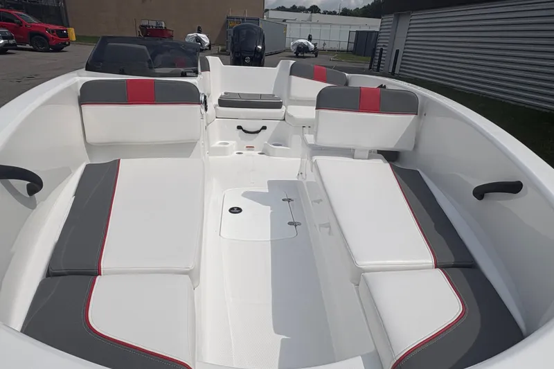 Slide: The Image of 2027 Tahoe T16 boat interior with white and gray seating, red accents, and spacious layout. - 8