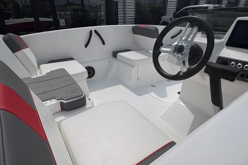 Slide: The Image of Interior of 2027 Tahoe T16 boat with modern steering and seating. - 5