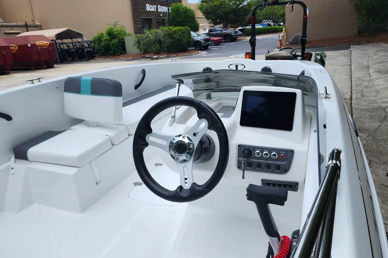 Slide: The Image of 2027 Tahoe T18 boat interior with steering wheel and control panel. - 5