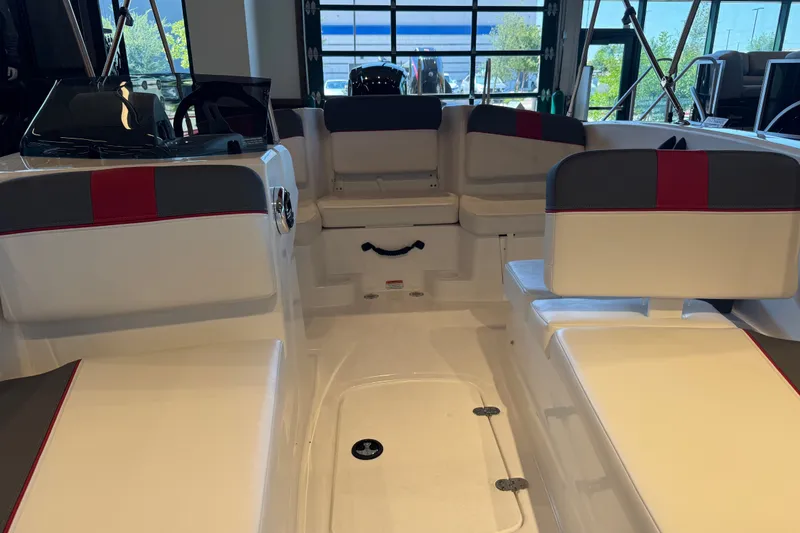 Slide: The Image of Interior view of a 2027 Tahoe T16 boat with white and red seating. - 62