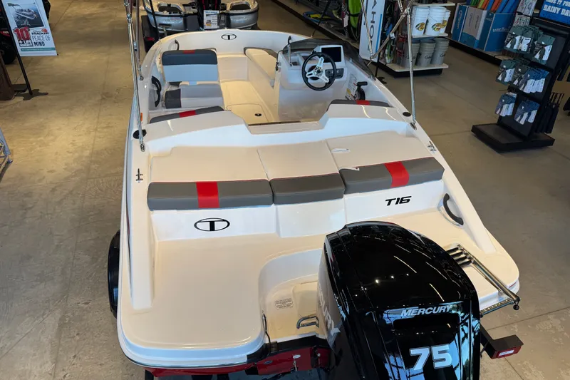 Slide: The Image of 2027 Tahoe T16 boat with Mercury 75 engine, displayed in a showroom. - 61