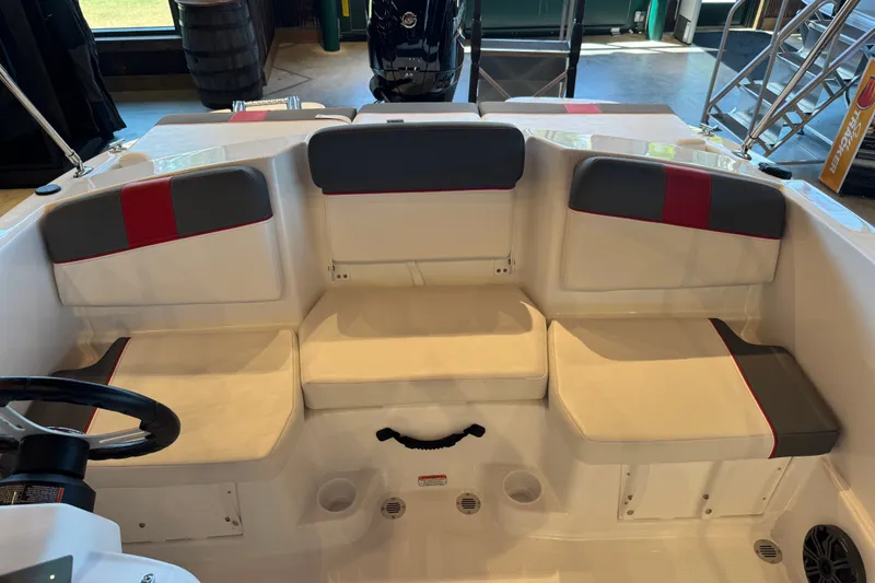 Slide: The Image of Interior seating of 2027 Tahoe T16 boat with white and gray upholstery. - 63