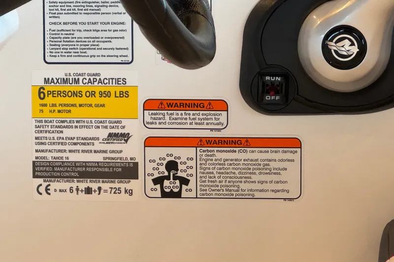 Slide: The Image of Safety and capacity labels on a 2027 Tahoe T16 boat dashboard. - 68