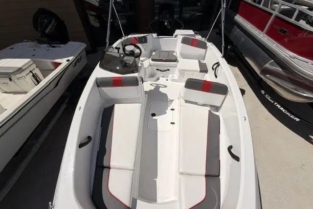Slide: The Image of 2027 Tahoe T16 boat with white and gray interior, red accents, and steering console. - 3