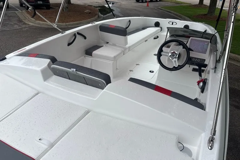 Slide: The Image of 2027 Tahoe T18 boat interior with steering wheel, seating, and navigation system. - 8