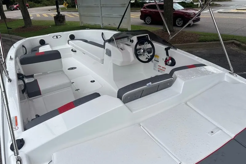 Slide: The Image of 2027 Tahoe T18 boat interior with seating, steering wheel, and modern design features. - 11