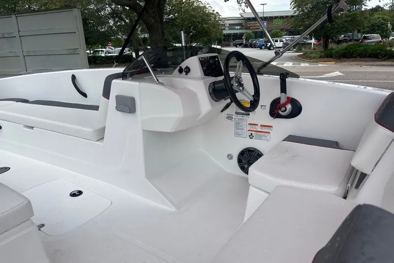 Slide: The Image of 2027 Tahoe T18 boat interior with steering wheel, seating, and control panel. - 10