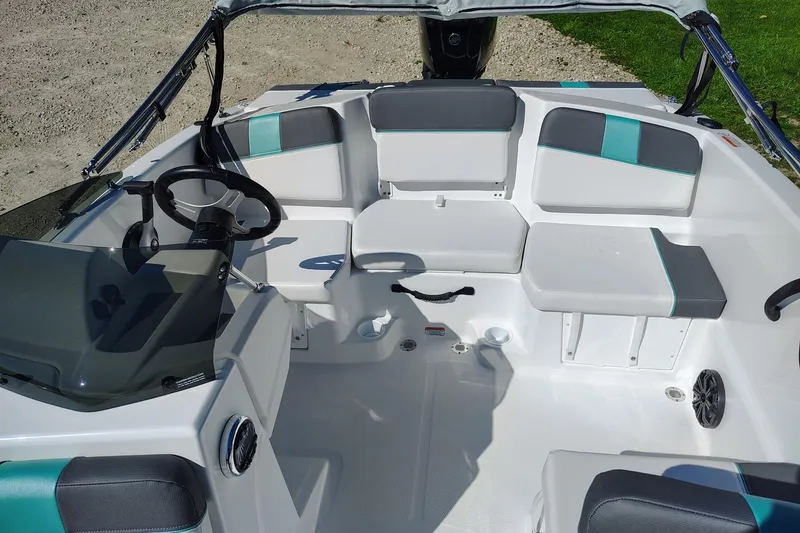 Slide: The Image of 2027 Tahoe T16 boat interior with modern seating and steering wheel. - 3
