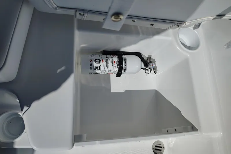 Slide: The Image of Fire extinguisher in 2027 Tahoe T16 boat compartment, securely mounted. - 8
