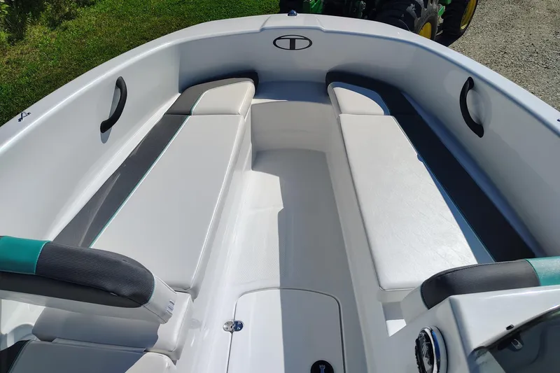 Slide: The Image of 2027 Tahoe T16 boat interior with white and gray seating, featuring modern design elements. - 7