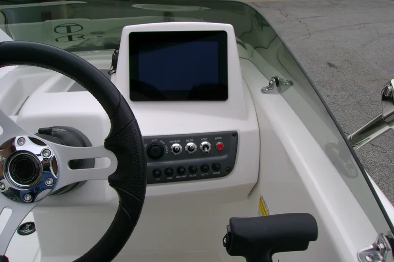 Slide: The Image of Steering console of 2027 Tahoe T16 boat with touchscreen and control panel. - 12