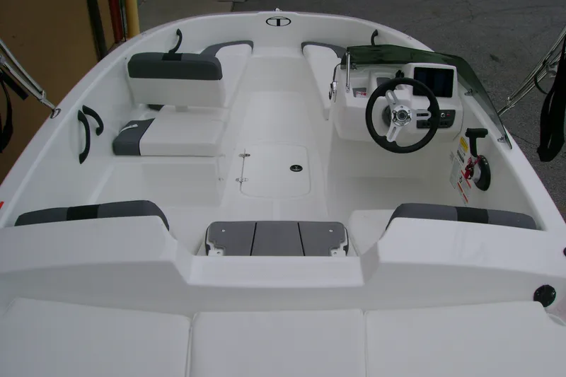 Slide: The Image of 2027 Tahoe T16 boat interior with steering console and seating arrangement. - 10