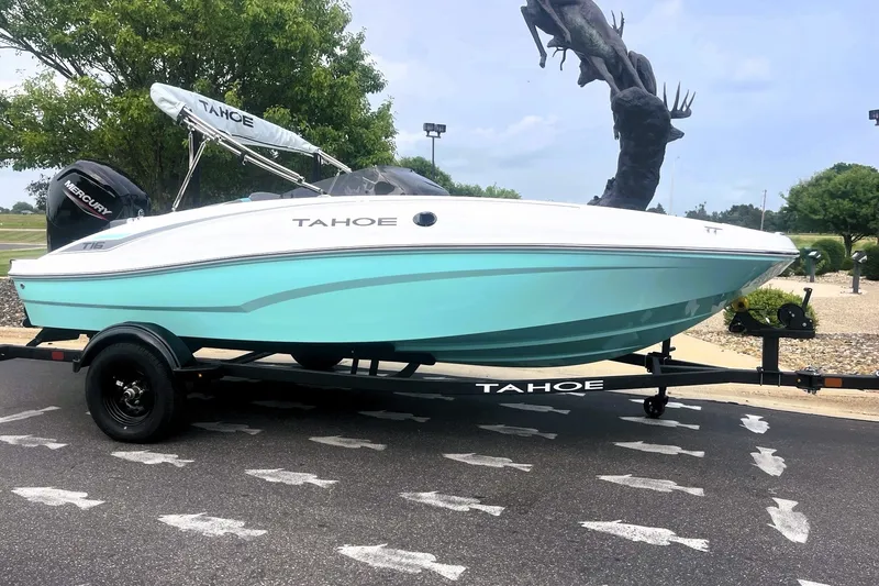 Slide: The Image of 2027 Tahoe T16 boat on trailer, parked outdoors, featuring sleek design and vibrant colors. - 8