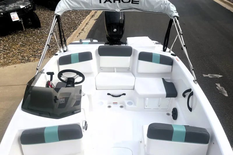 Slide: The Image of 2027 Tahoe T16 boat interior with seating, steering wheel, and canopy. - 3